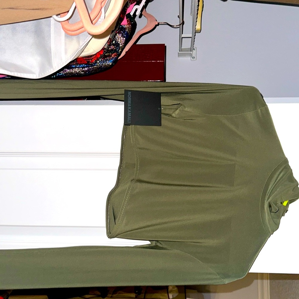 Sexy slightly cowl turtle neck crop top by Norma Kamali w tags still attached.